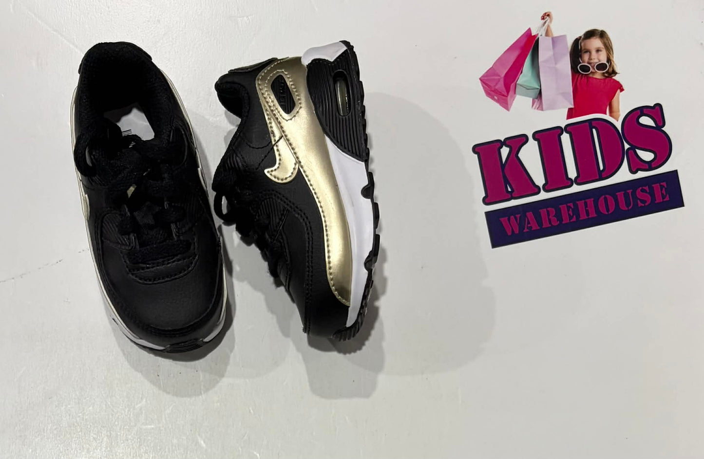 Nike Black, Gold, White Runners Size US5/UK4.5 (Child)